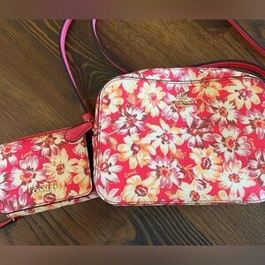 Coach camera bag with matching wallet.